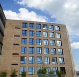 how_commercial_real_estate_firms_can_benefit_from_a_b2b_business_growth_consultant A multi-storey building taken at an angle