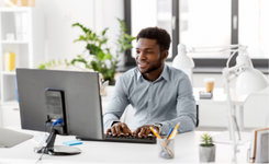 A team member works on his work computer