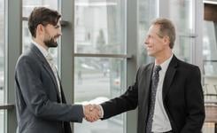 Two business people shake hands