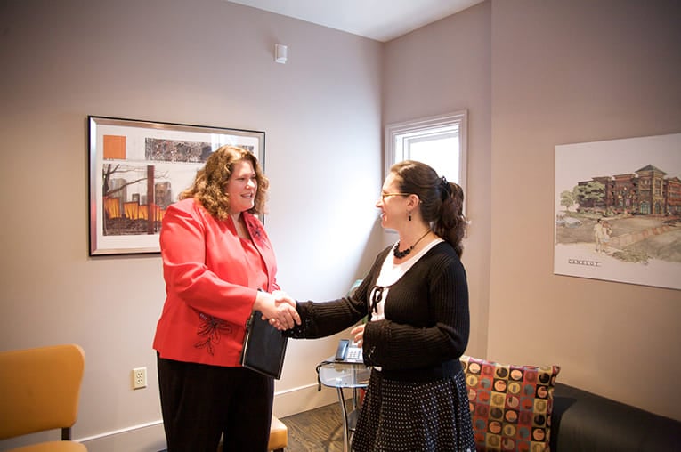 Two business people shaking hands