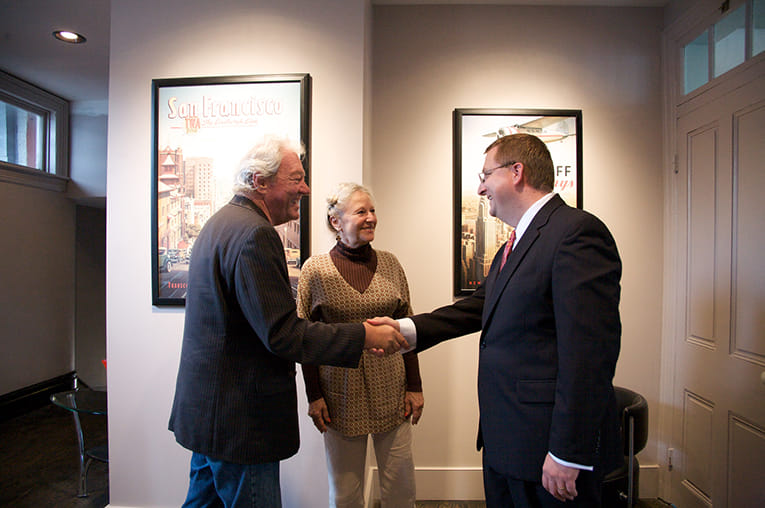 Doug shares a handshake with a client after another successful business meeting