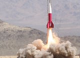 A rocket on the launch pad getting ready for take off