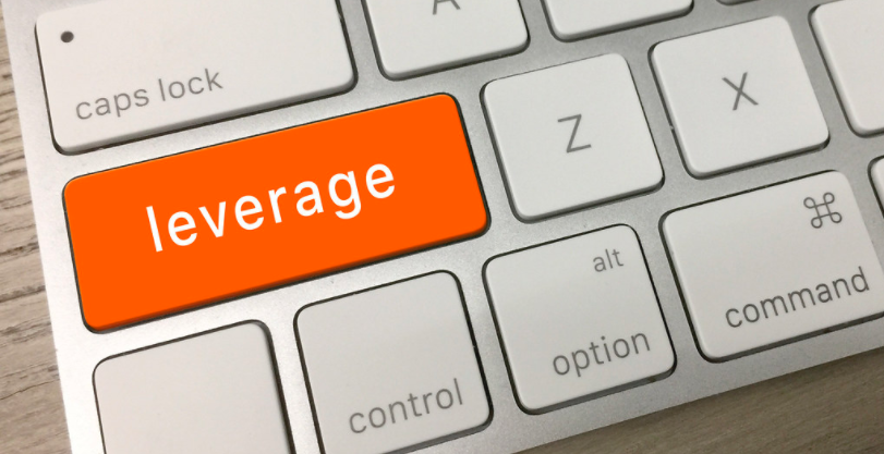 A close-up of a keyboard with a button called leverage standing out in orange