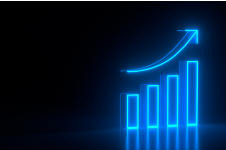 A black background photo with neon blue pillars showing sales growth with an upward, curved arrow